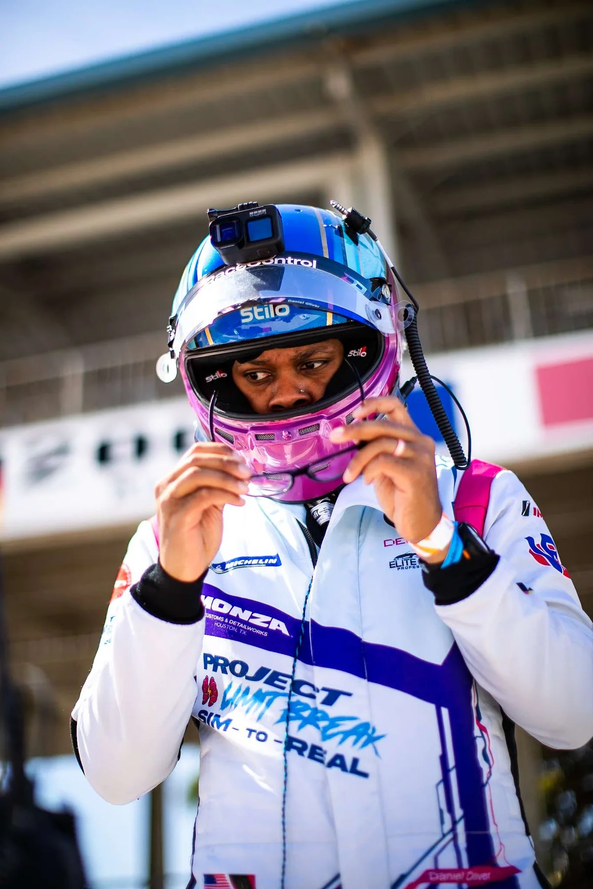 Daniel Oliver fastening his helmet before a session