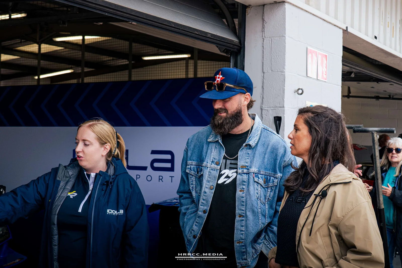 Daniel walking sponsor guests through the program in the garage