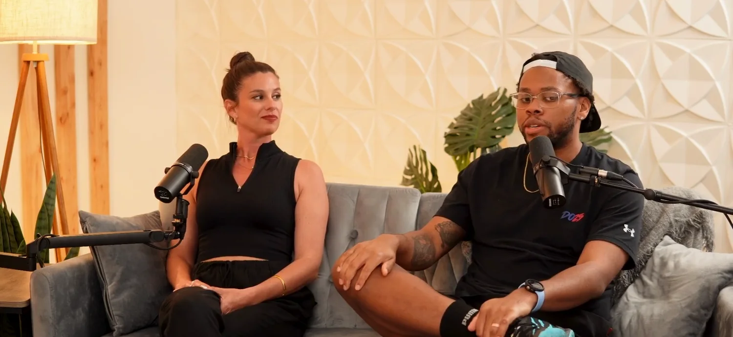 Daniel on a podcast set with a host, mid-conversation